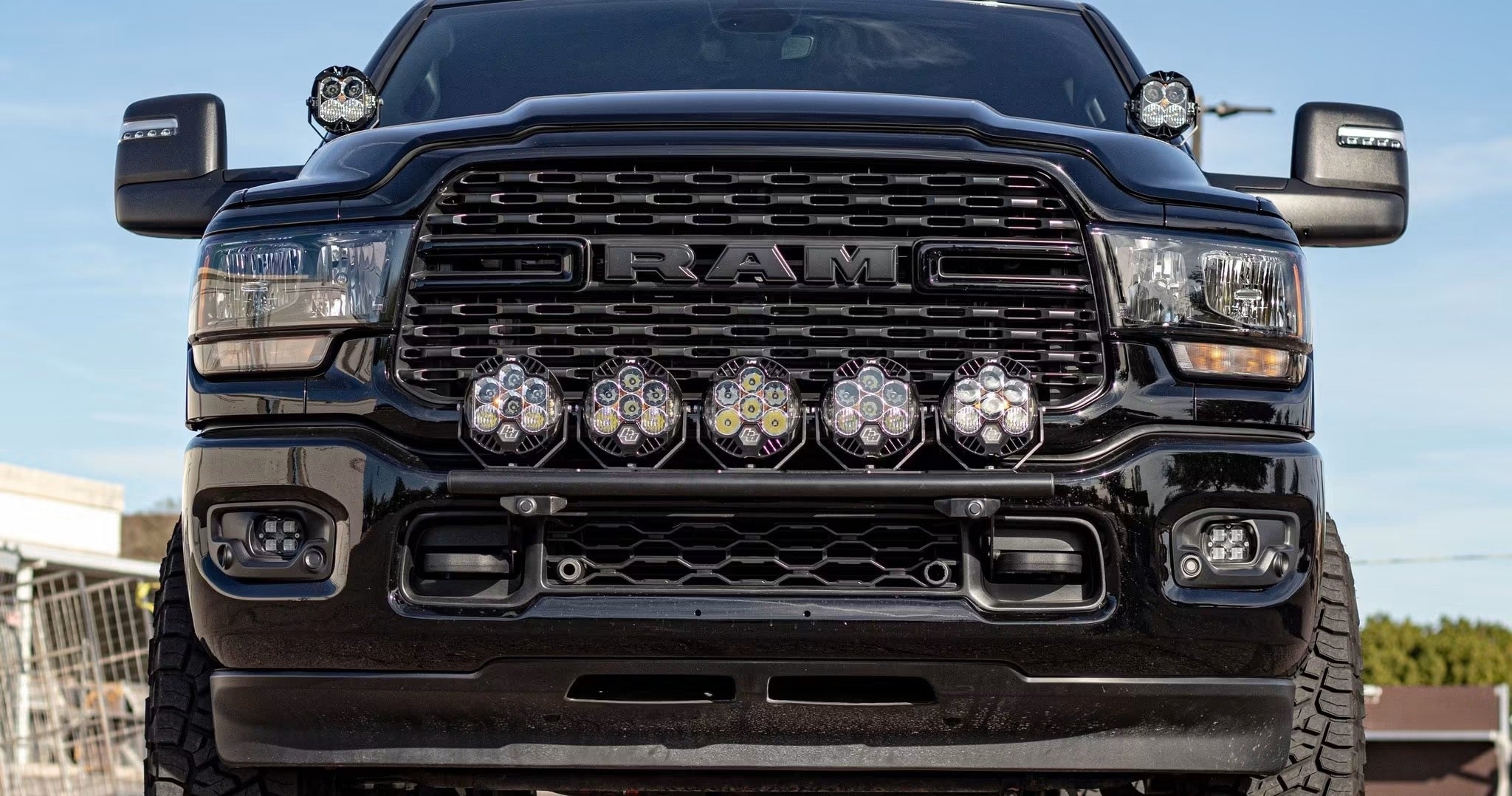 Black RAM truck with aftermarket LED pod lighting installed at Jax Motorsports