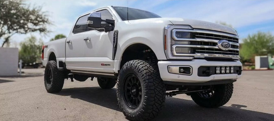 Lifted gloss white Ford F-250 Power Stroke on a Carli 5.5-inch Back Country kit with 20x10 Method 323 wheels and 38-inch Nitto Ridge Grapplers, built by Jax Motorsports for a Mesa customer