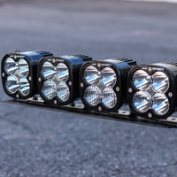 Close-up front view of the JAX MFG Ford Super Duty light mount loaded with 4 Baja Designs XL Sport lights