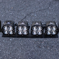 Straight-on view of the satin black JAX MFG Ford Super Duty light mount with 4 Baja Designs XL Sport lights