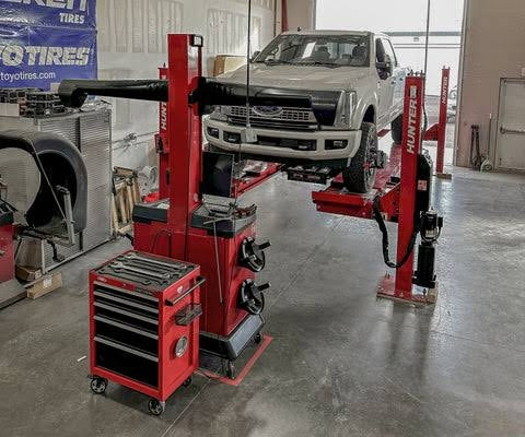 Hunter Hawkeye Elite alignment rack with a truck on the lift at Jax Motorsports in Gilbert, AZ
