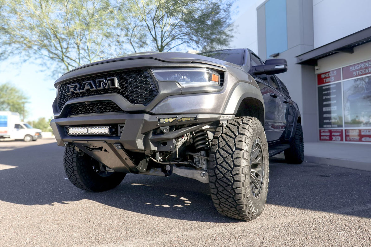 Ram TRX with an aftermarket front bumper and LED light bar at Jax Motorsports in Gilbert, AZ