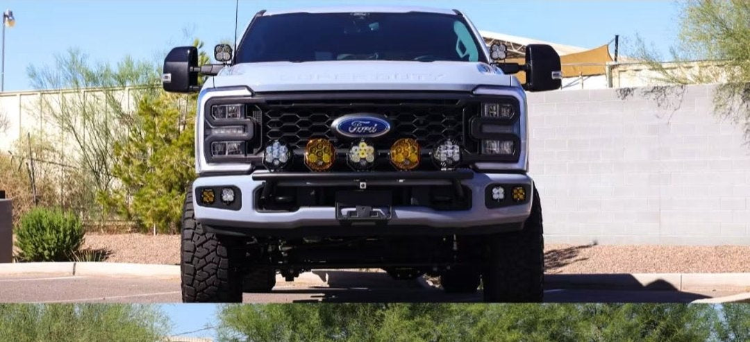Front view of the F-350 showing Baja Designs XL80s on SDHQ A-pillar mounts