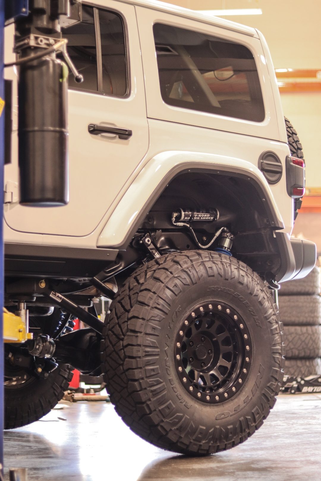 Rear suspension detail showing the King coilover and EVO control arms