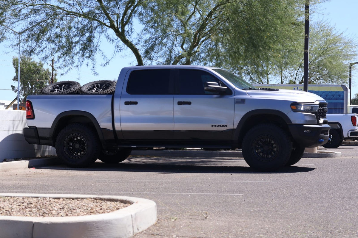 Side profile showing the leveled stance of the 2025 Ram 1500 Rebel