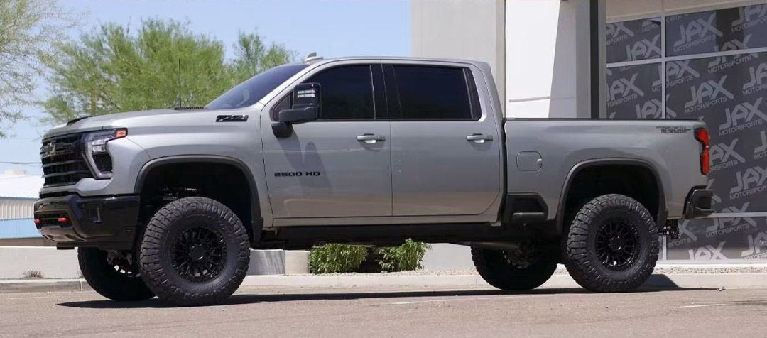 Driver-side full profile of the lifted Silverado 2500 HD
