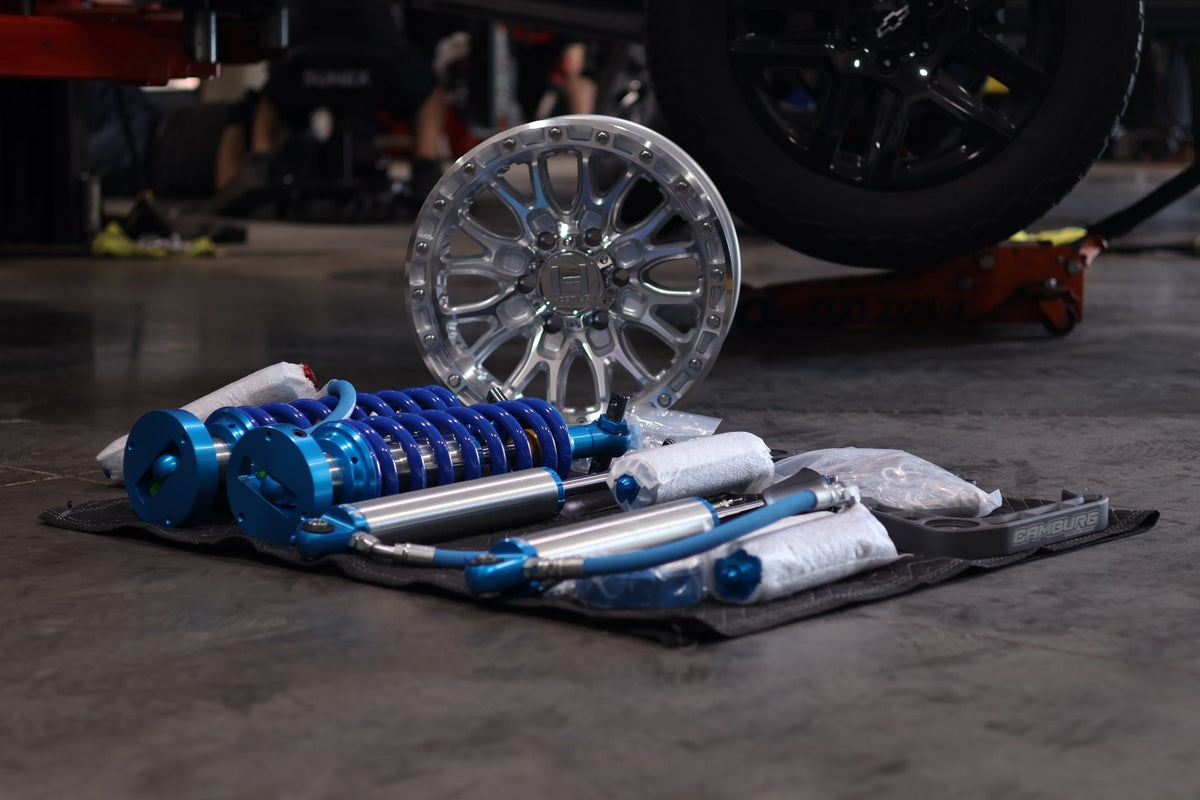 King coilovers, Camburg control arms and Hostile wheel laid out on the shop floor