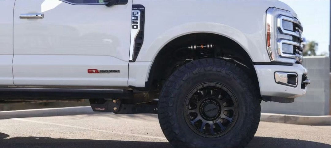 Close-up of the 18-inch Method 709HD wheel, Toyo R/T Trail tire, and Carli suspension