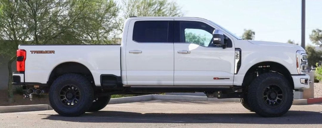Full side profile of the lifted white F-350 Platinum Tremor