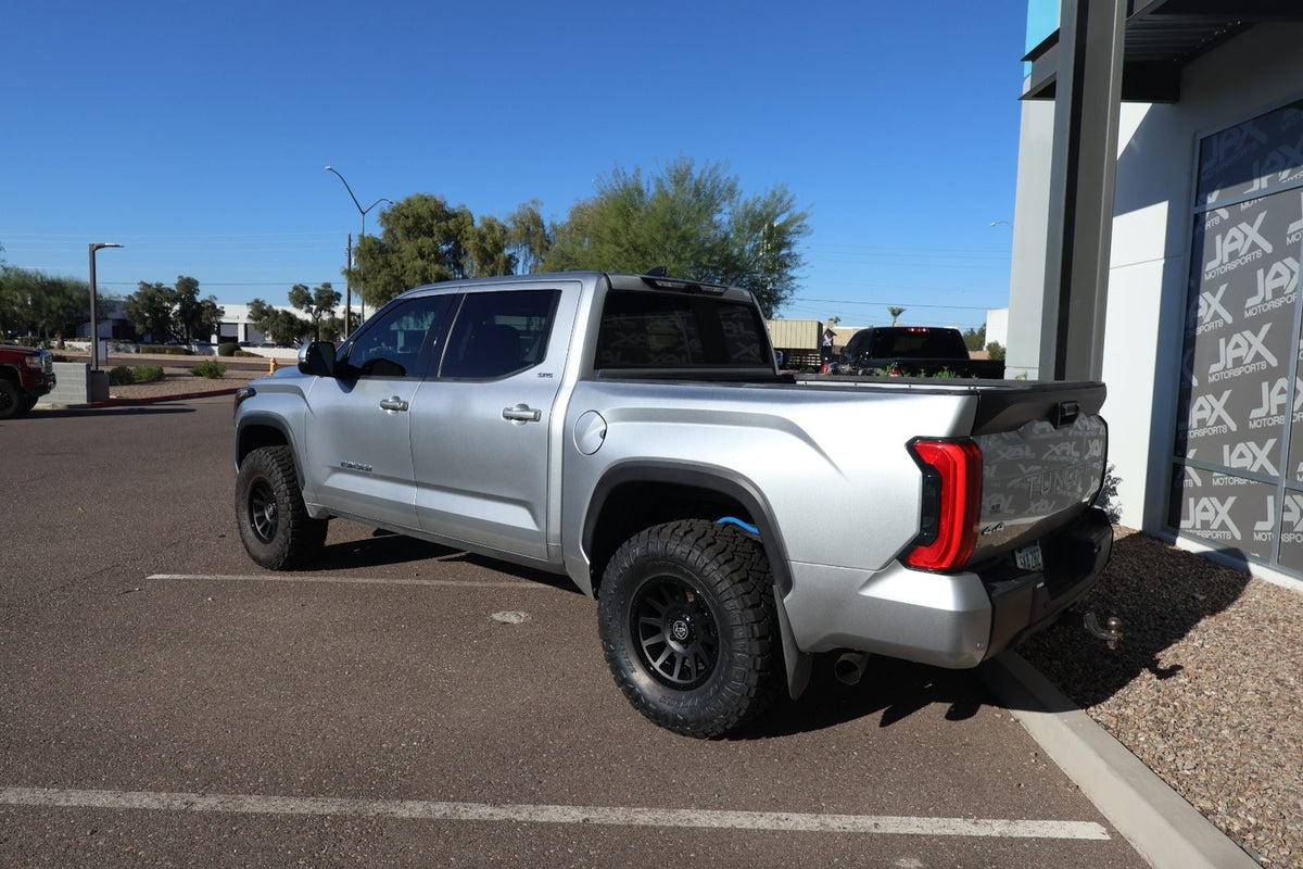 Rear three-quarter view of the 2024 Toyota Tundra with Icon Alloy Compression wheels and Nitto Ridge Grapplers