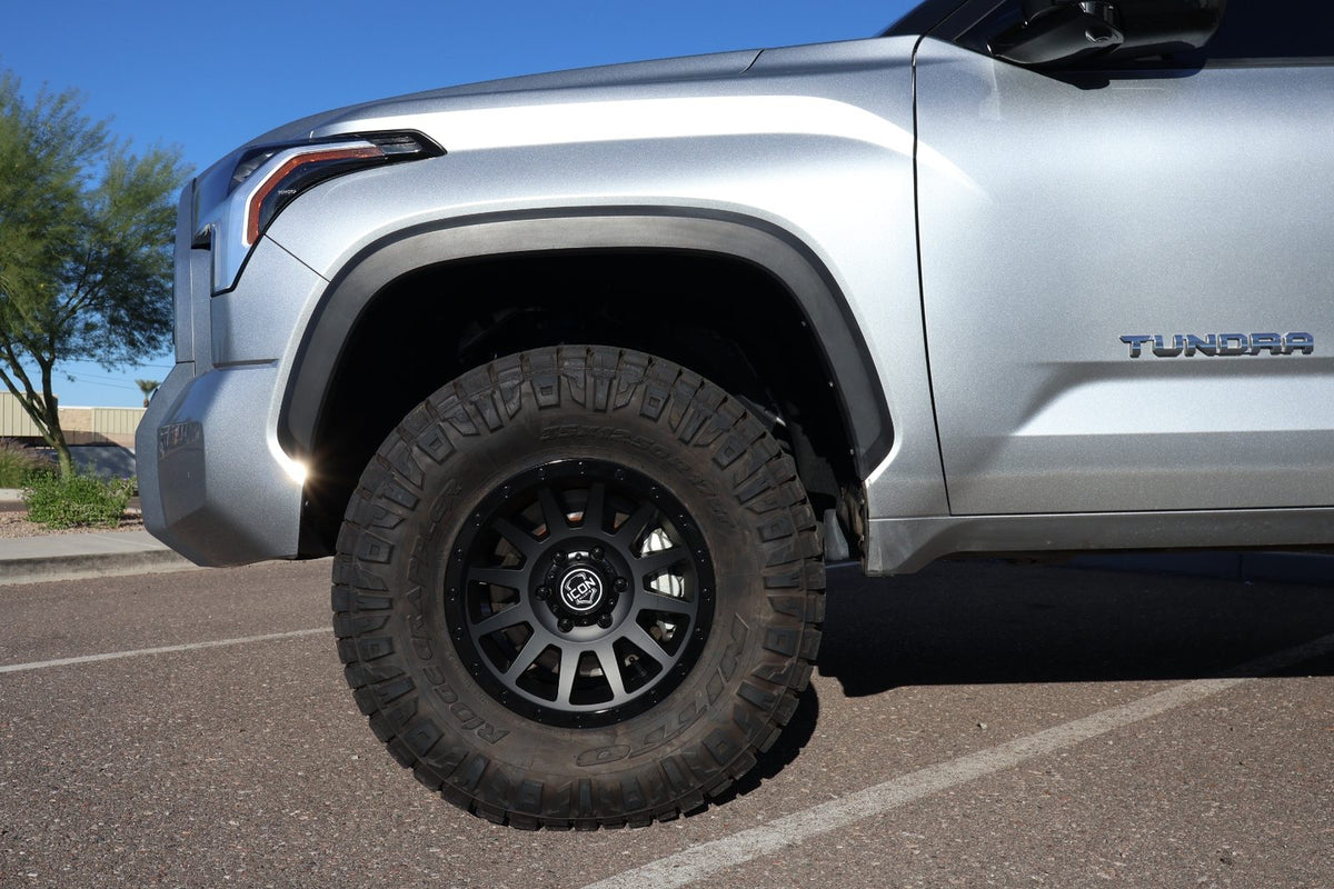 Front wheel detail showing the Icon Alloy Compression wheel and 35/12.5R17 Nitto Ridge Grappler tire