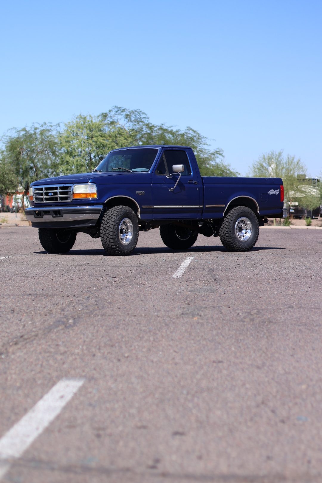 Front three-quarter view from a distance of the lifted OBS F-150