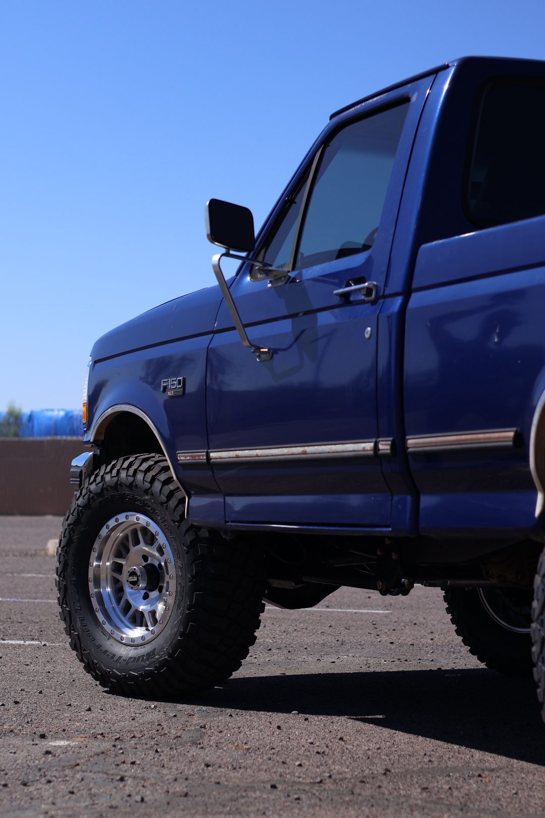 Close-up of the F-150 XLT fender badge and chrome trim