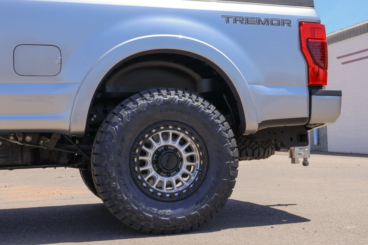 Side profile of the rear driver wheel and bed of the Tremor